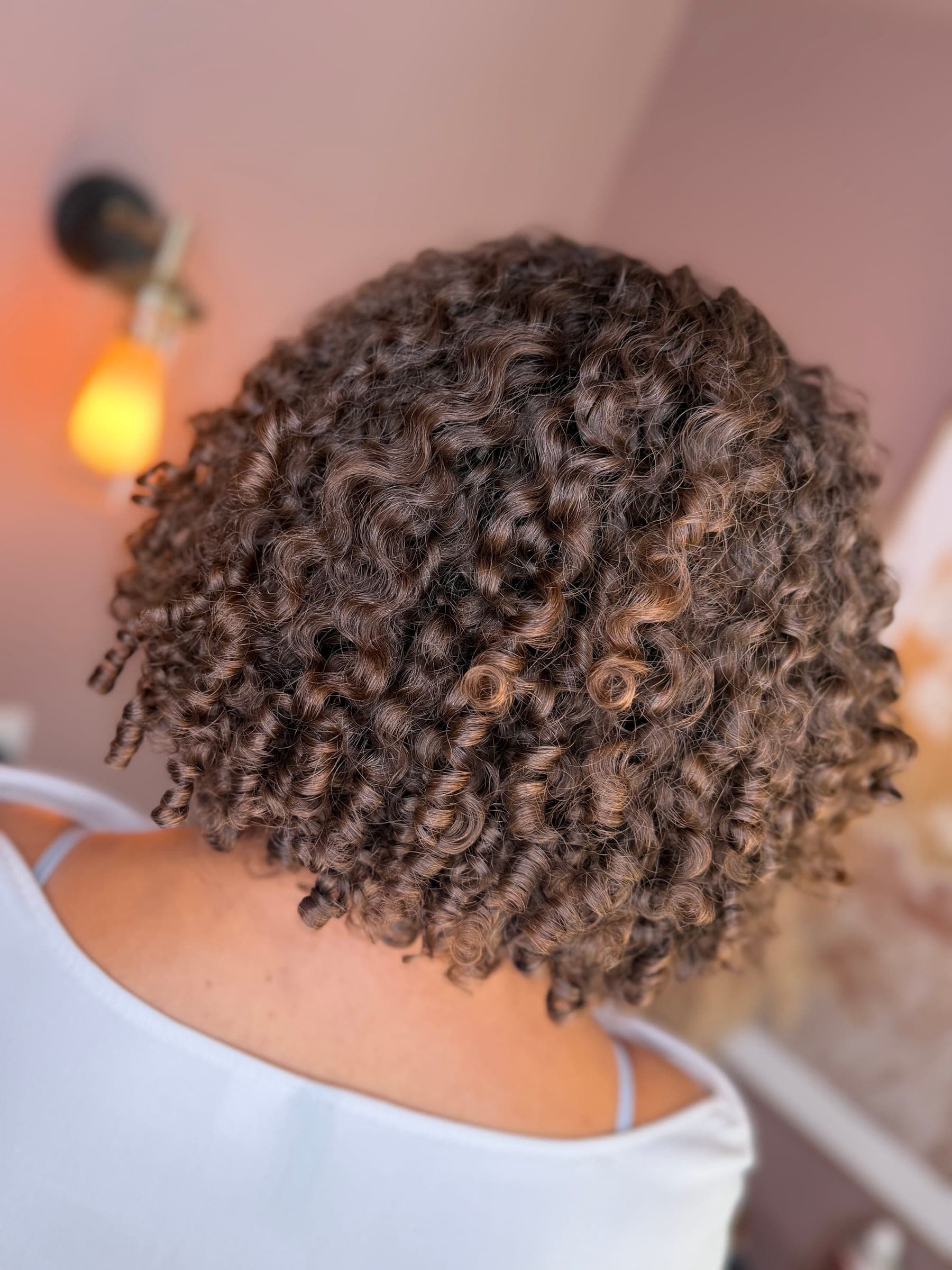 Tight, defined ringlets photographed close up in the salon